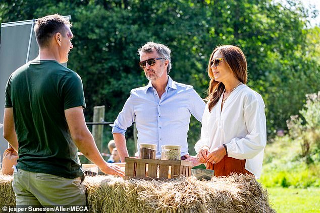 The pair were pictured sampling local produce and chatting to small business owners during their tour of the tiny island 105 miles southeast of Copenhagen