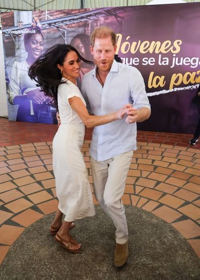 New photos reveal Harry and Meghan's public display of special affection